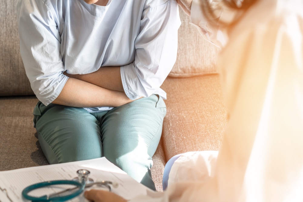 Abdominal,Pain,Patient,Woman,Having,Medical,Exam,With,Doctor,On